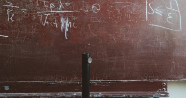 Written Equation On Brown Chalkboard