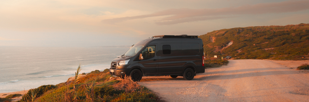 Van Parked On The Road During Sunset