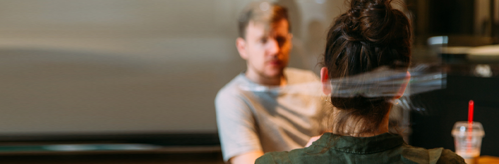 Back Of Woman Sitting At Cafe