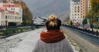 Woman In Gray Sweater Looking Over Bridge