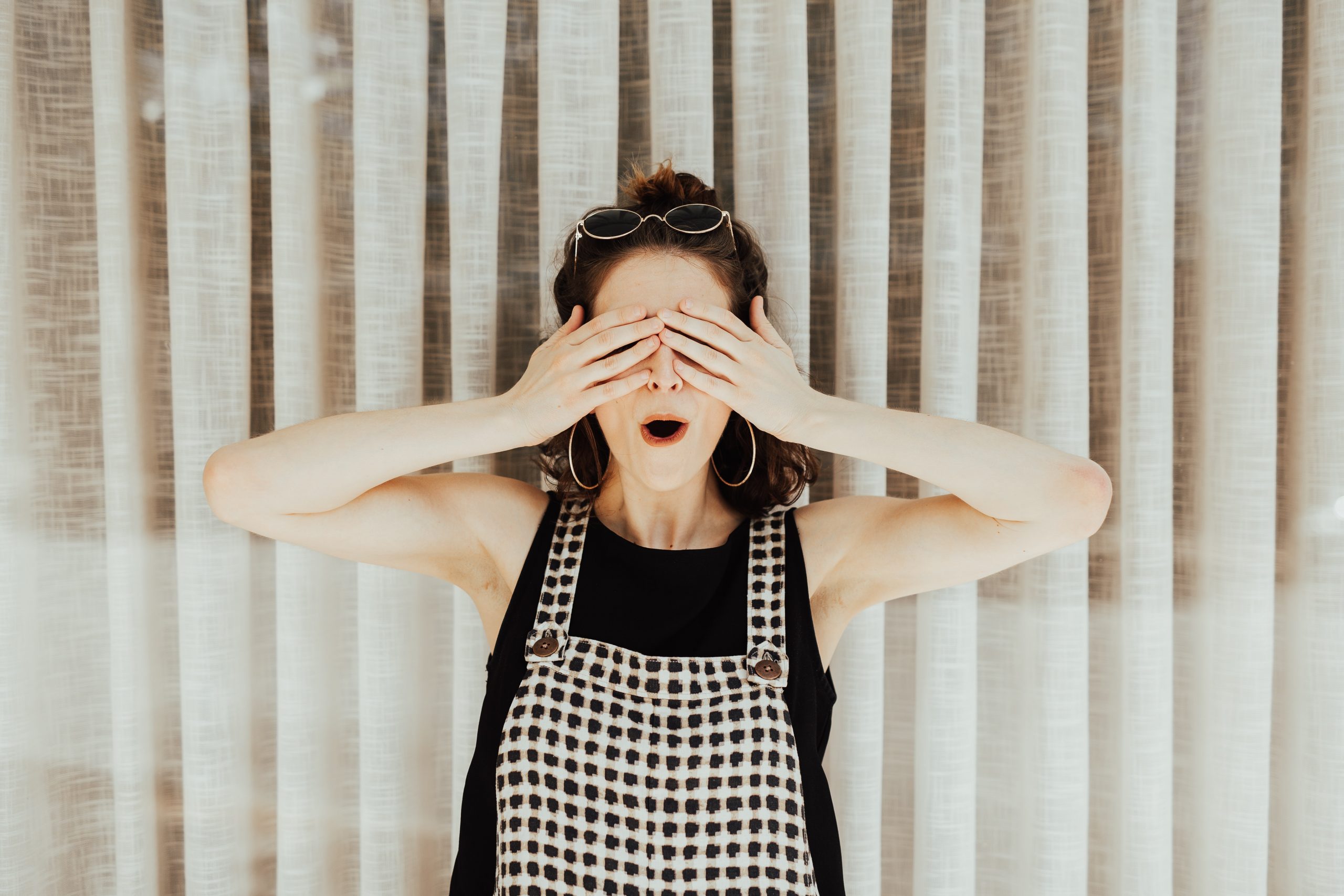 Woman Covering Her Eyes With Her Hands.