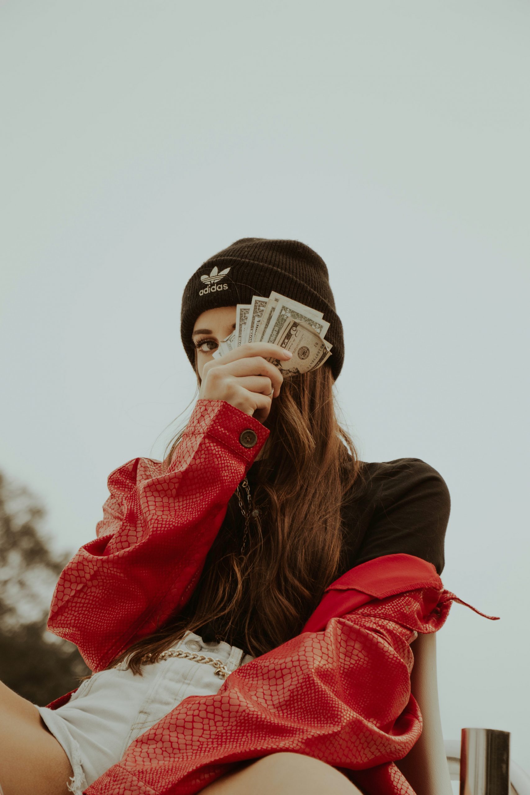 Woman Wearing Black Hat Holding Money