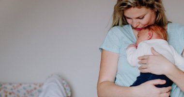 Young Mom Holding Baby