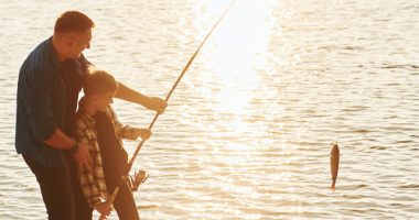 Father And Son Fishing Together