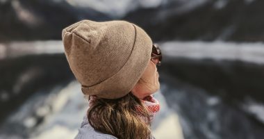 Woman In Hat And Sunglasses Looking At The Mountain