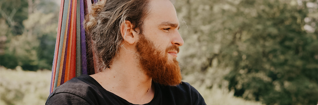 Man With Beard In Black T-shirt Looking Away