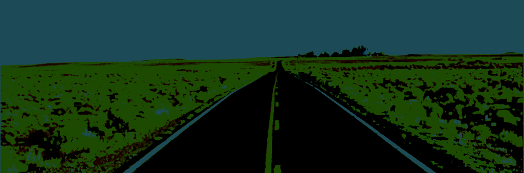 Black Road With Green Grass Blue Sky