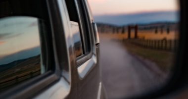 Wing Window With Reflection Of Desert Road